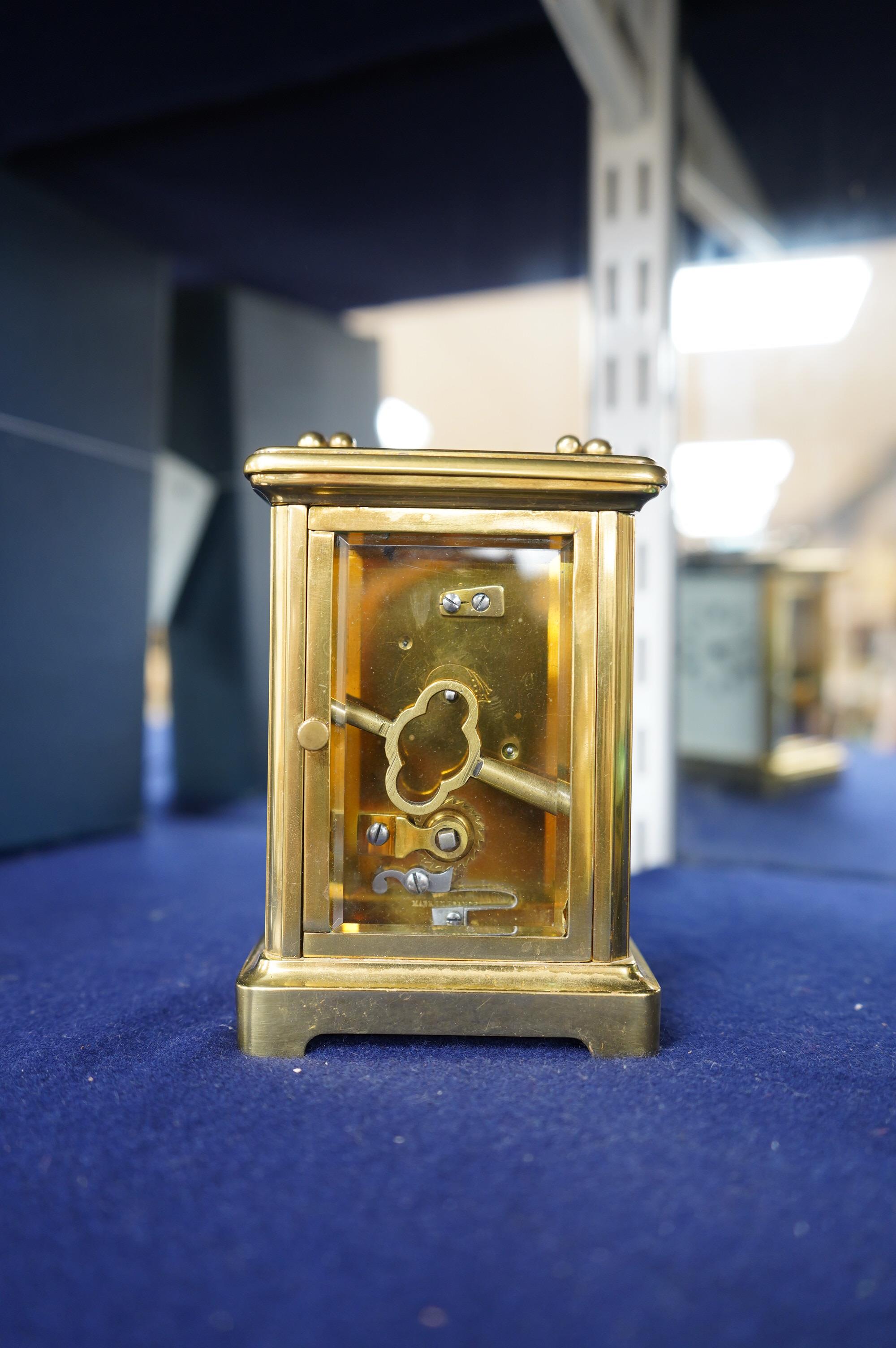 A brass carriage timepiece, 11.5cm high. Condition - good.